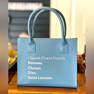 LA Trading Co “I Speak Fluent French…Hermes Chanel Dior…” crossbody tote